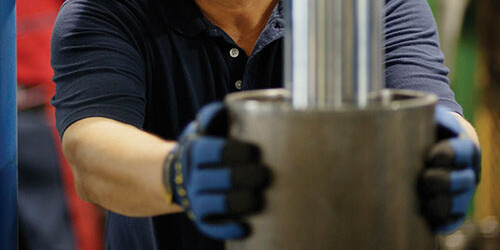 packing and piston rod Employee checks packing and piston rod