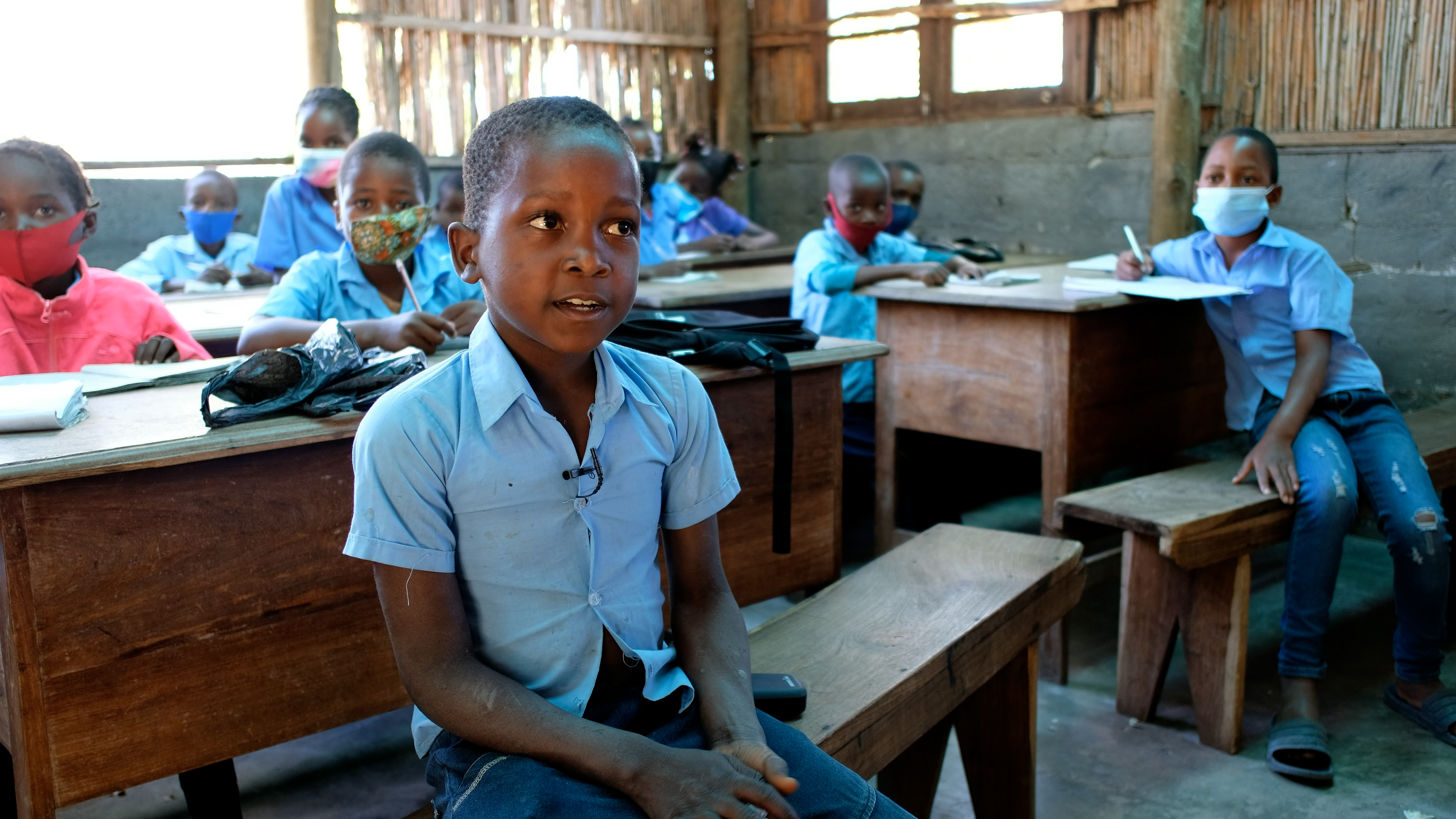 boy at a school desk in Africa boy at a school desk in Africa